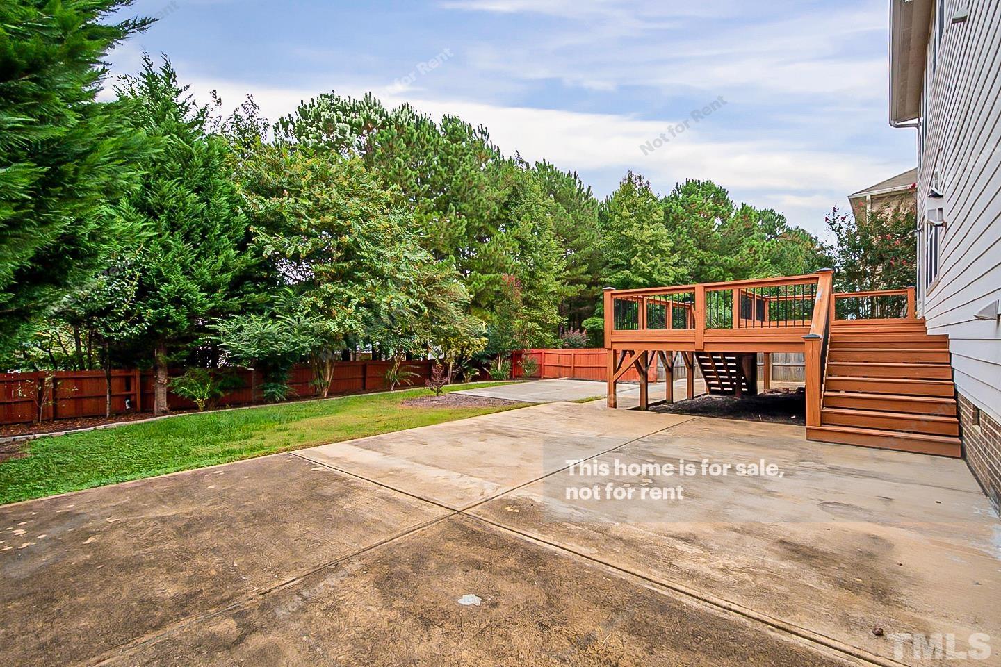 10129 Darling Street Raleigh, NC 27613 - Photo 22 of 24 a house view with a garden space