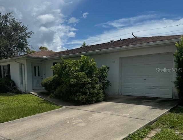 404 Briarwood Road Venice, FL 34293 - Photo 1 of 1 front view of house with a yard