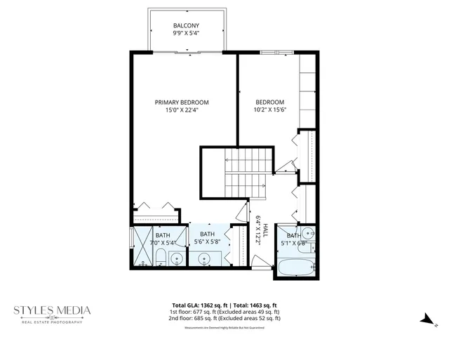 a picture of a bench in front of a wall