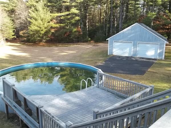 87 Howland Road Lakeville, MA 02347 - Photo 8 of 8 a view of a wooden deck and a backyard