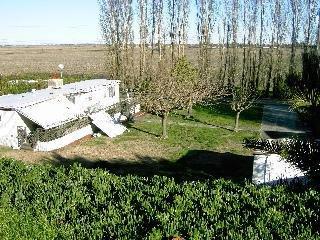 621 Brannan Island Road Isleton, CA 95641 - Photo 3 of 3 a view of a lake with a yard