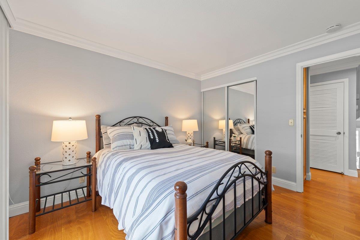 160 Troon Way Half Moon Bay, CA 94019 - Photo 20 of 28 a bedroom with a bed and a table