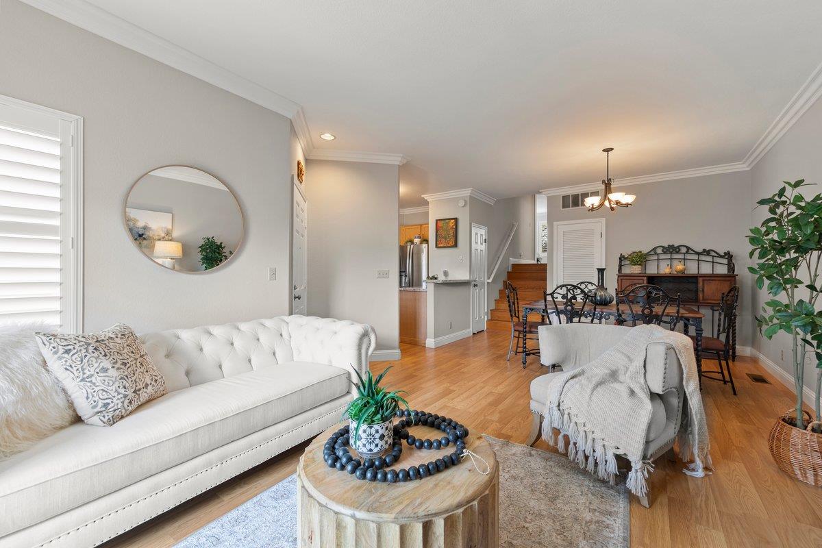 160 Troon Way Half Moon Bay, CA 94019 - Photo 8 of 28 a living room with furniture and a chandelier