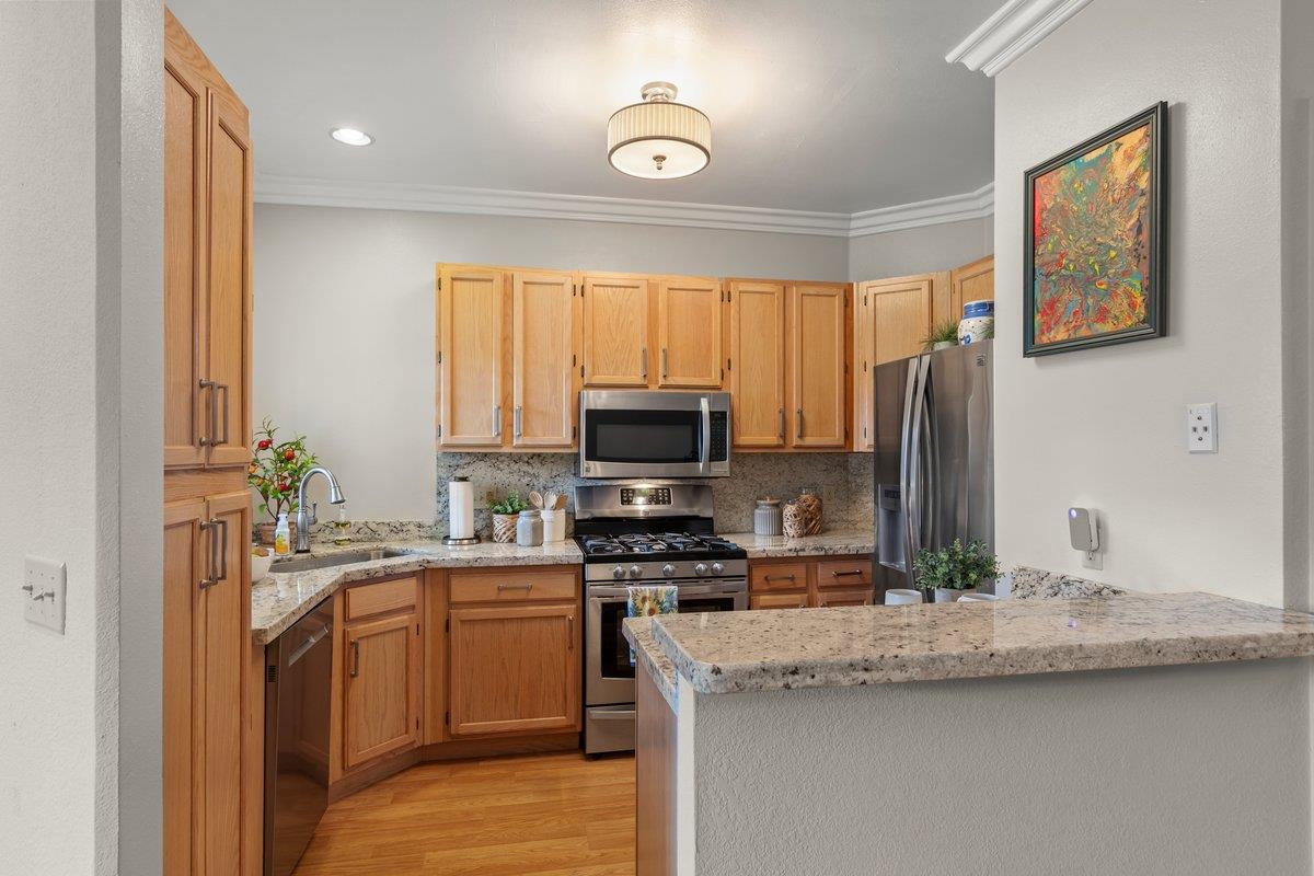 160 Troon Way Half Moon Bay, CA 94019 - Photo 9 of 28 a kitchen with a sink stove and refrigerator
