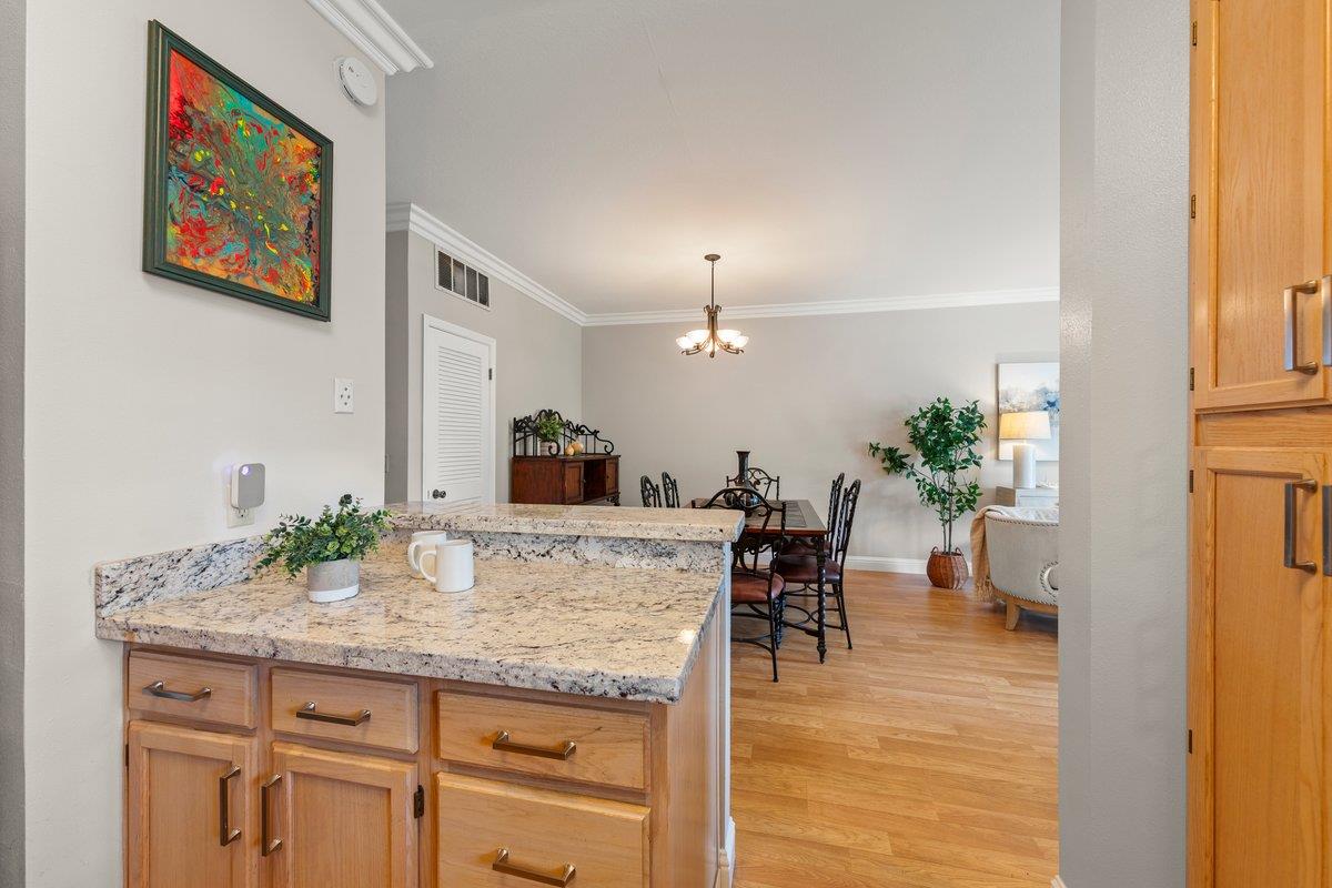160 Troon Way Half Moon Bay, CA 94019 - Photo 10 of 28 a view of a dining room with furniture and a chandelier