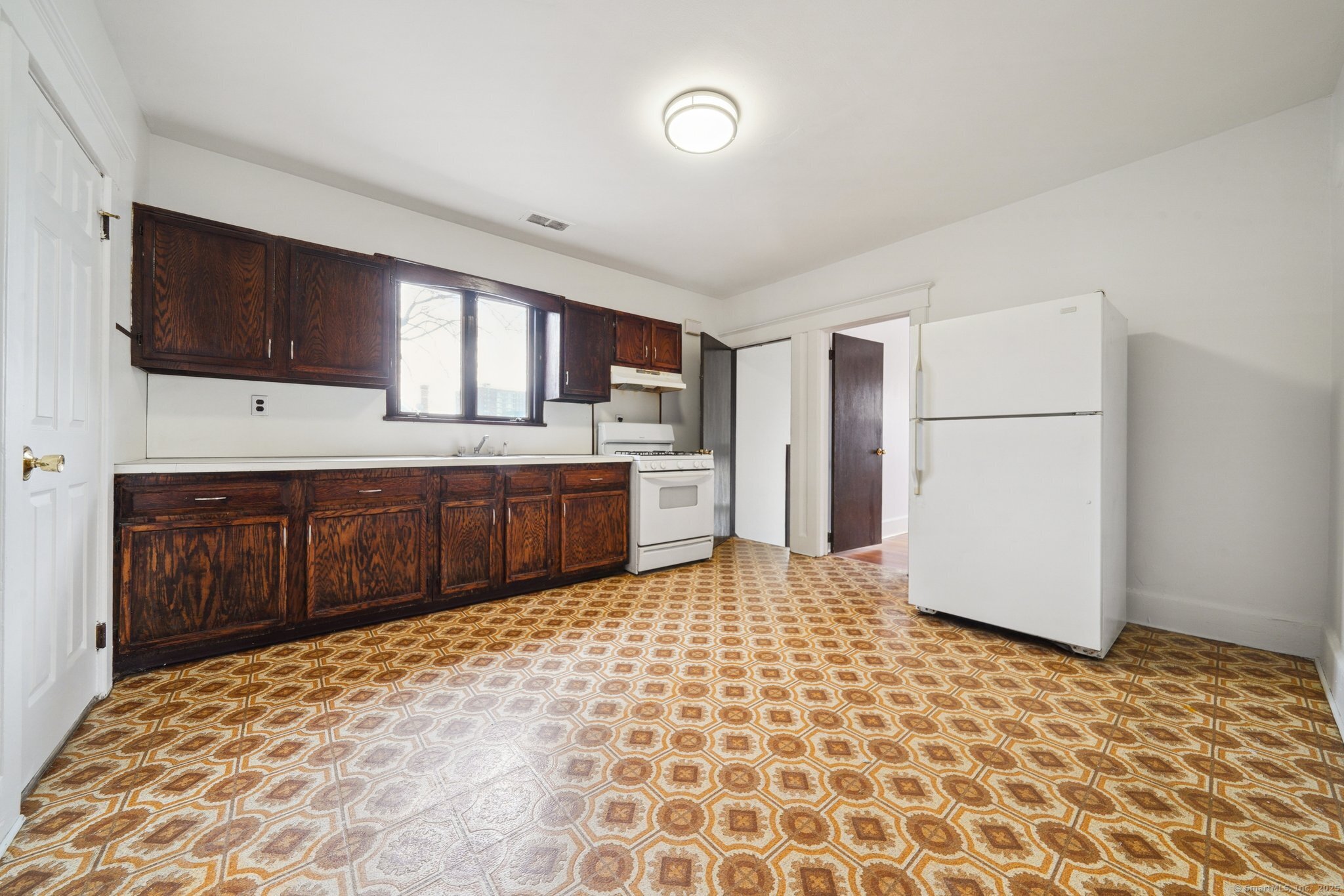 17 Alden Street Stamford, CT 06902 - Photo 13 of 34 a kitchen with stainless steel appliances granite countertop a refrigerator and a stove top oven