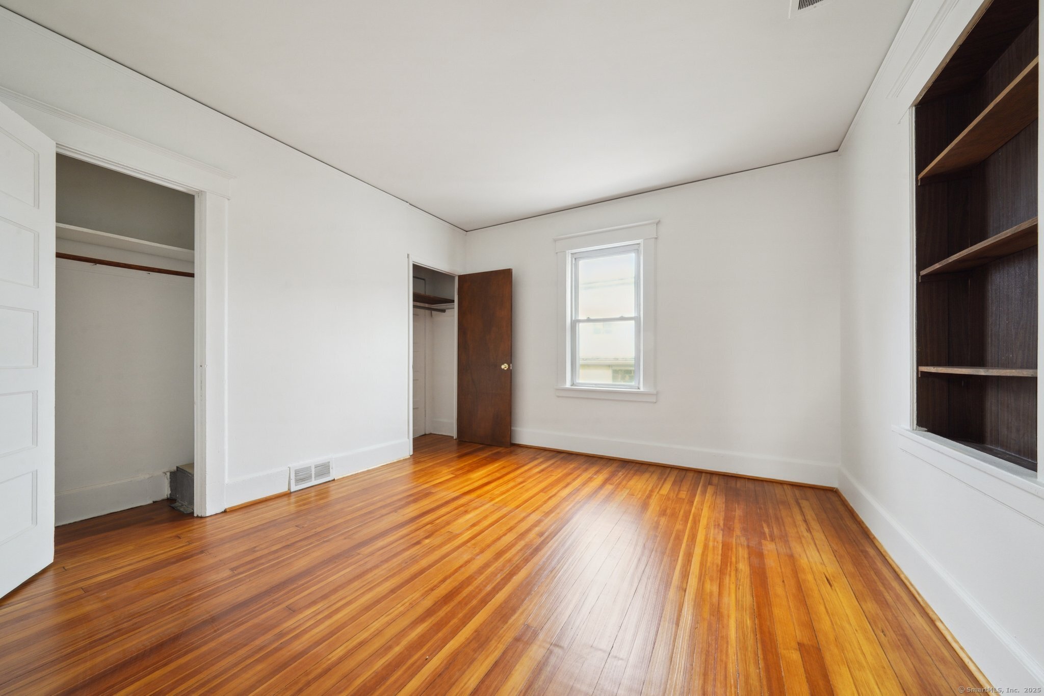17 Alden Street Stamford, CT 06902 - Photo 14 of 34 a view of empty room with wooden floor and fan