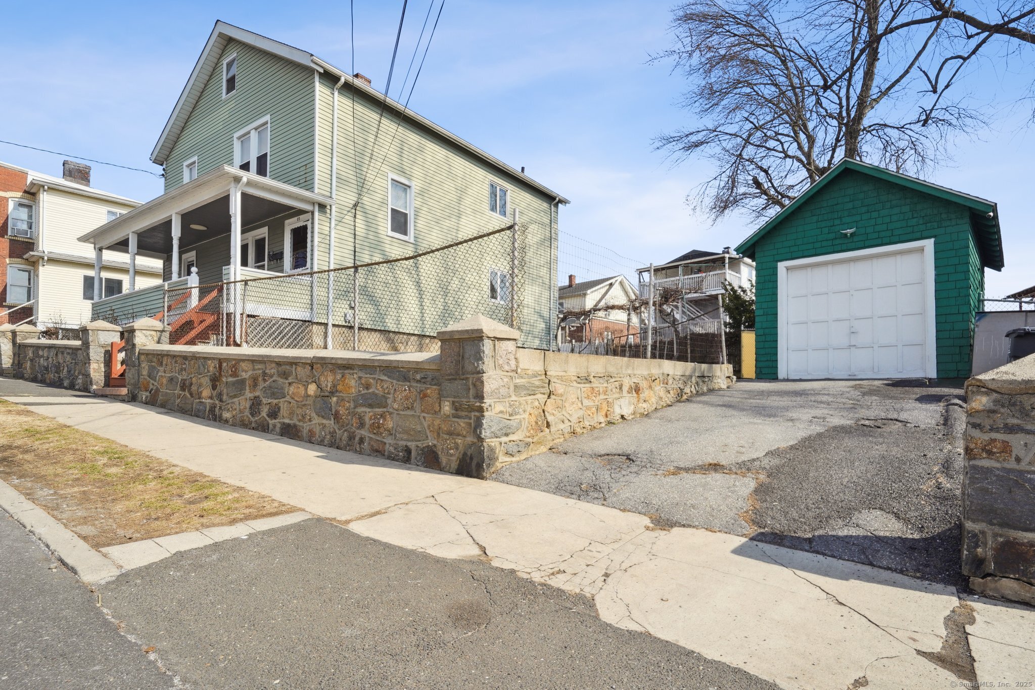 17 Alden Street Stamford, CT 06902 - Photo 27 of 34 a view of a house with snow on the road