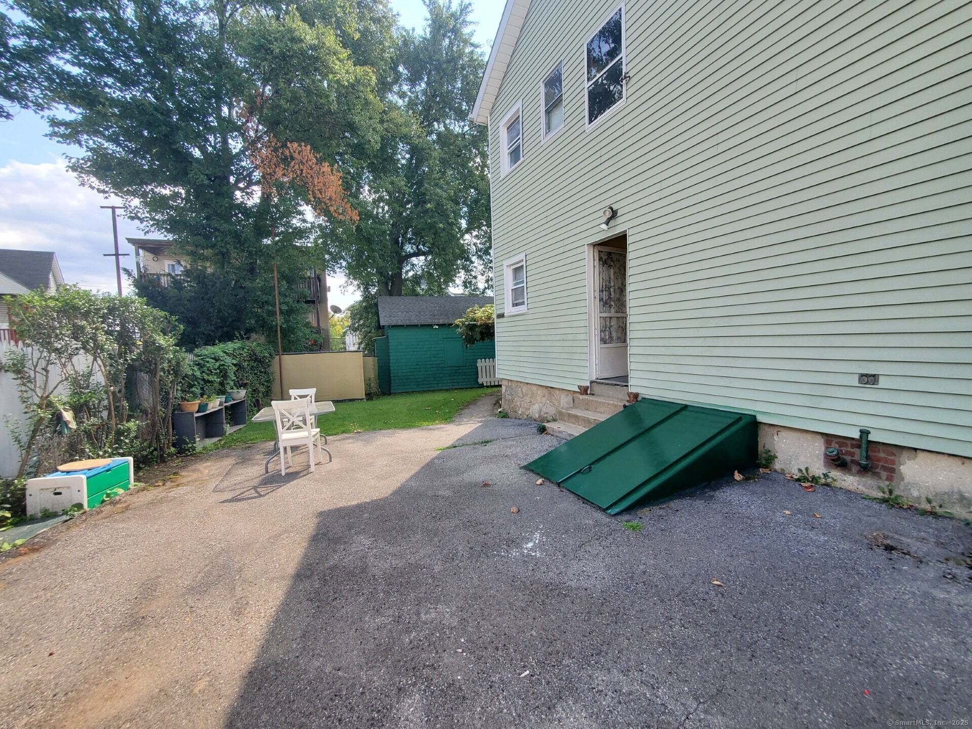 17 Alden Street Stamford, CT 06902 - Photo 28 of 34 a view of a backyard with sitting area