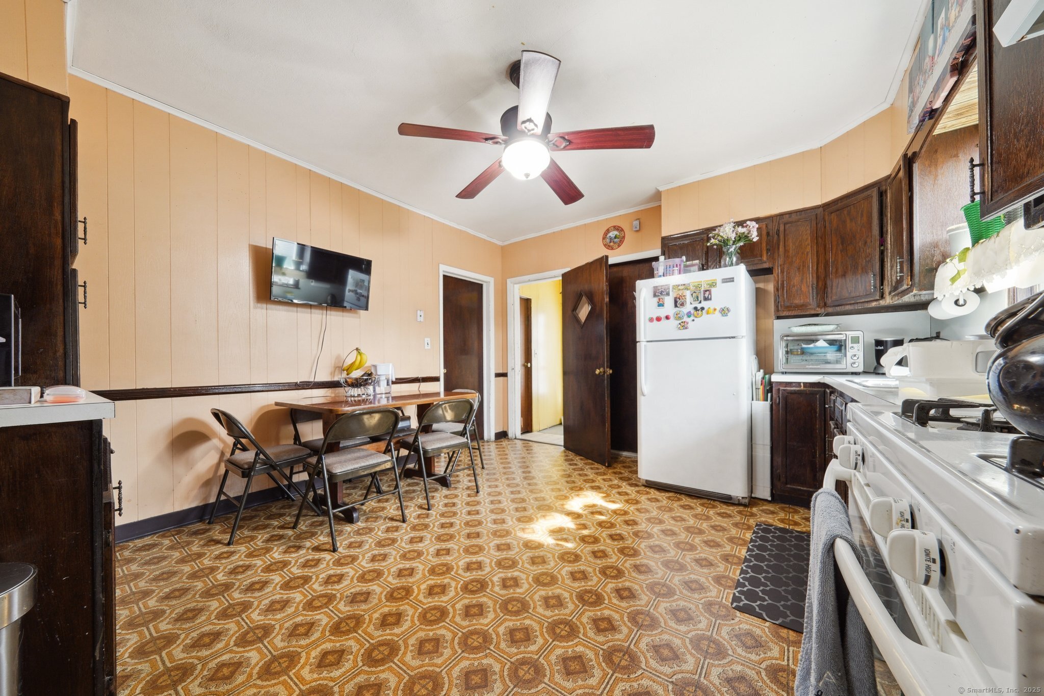 17 Alden Street Stamford, CT 06902 - Photo 6 of 34 a view of a kitchen with dining area a sink and a refrigerator