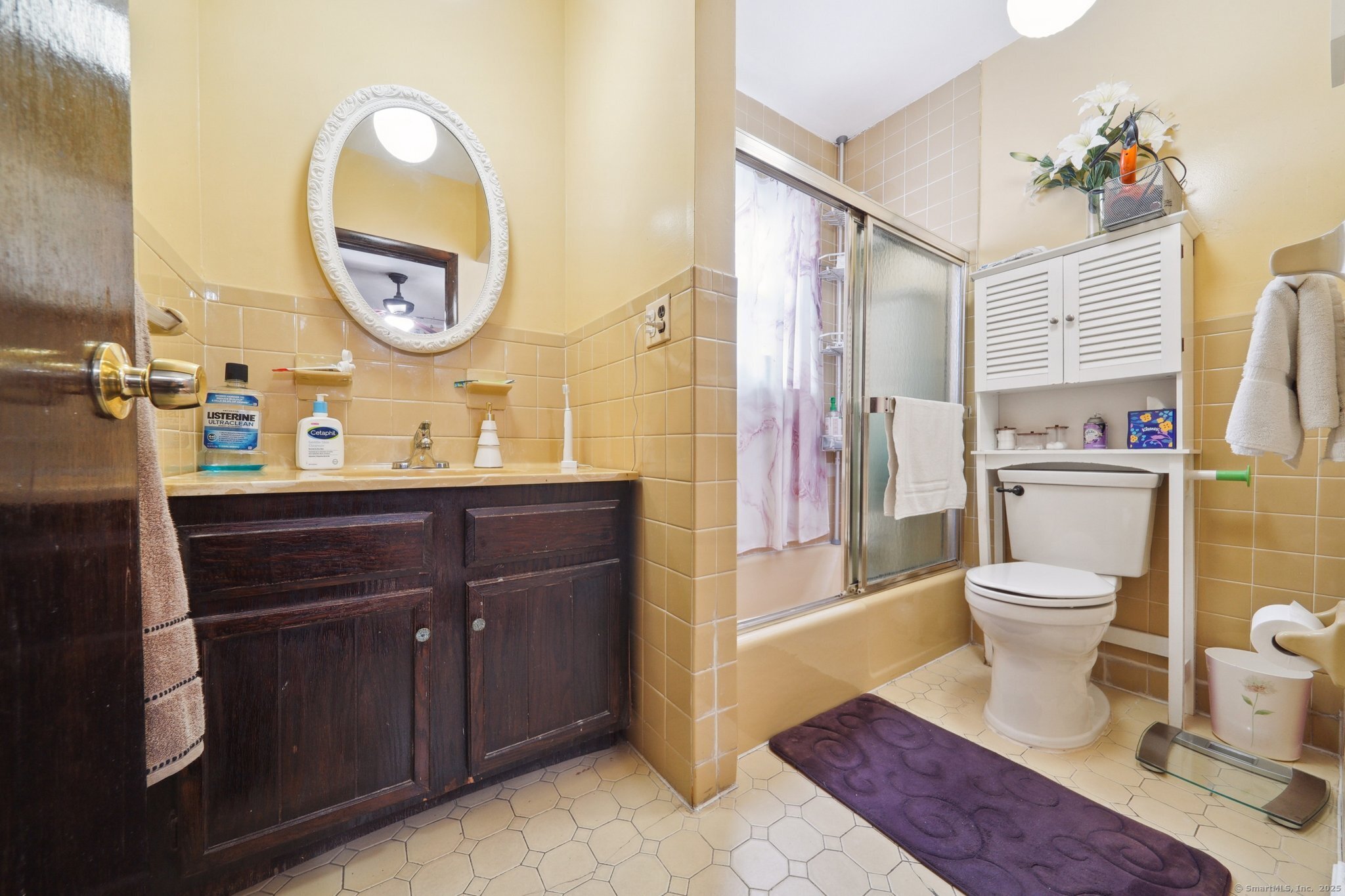 17 Alden Street Stamford, CT 06902 - Photo 9 of 34 a bathroom with a toilet a sink and a mirror