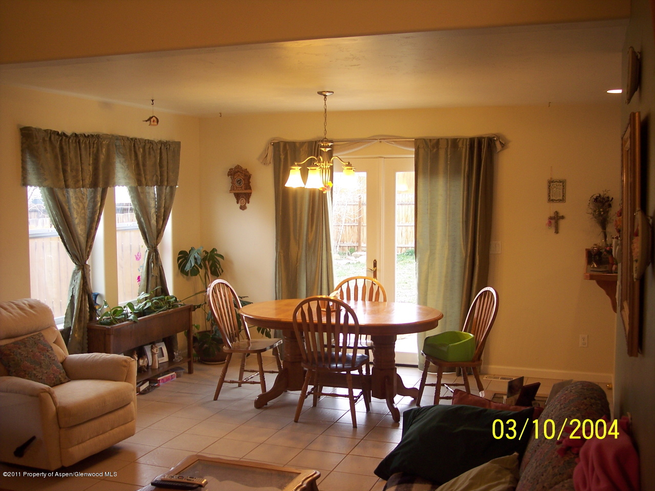 1292 East 18th Way Rifle, CO 81650 - Photo 3 of 6 a view of a livingroom with furniture and windows