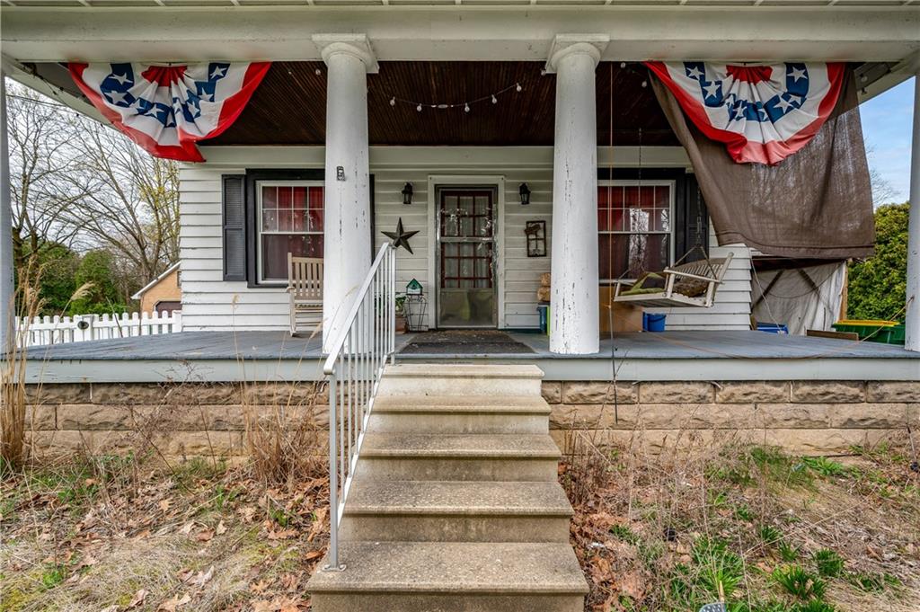 506 Meridian Road Renfrew, PA 16053 - Photo 4 of 10 a view of a house with large windows and rug