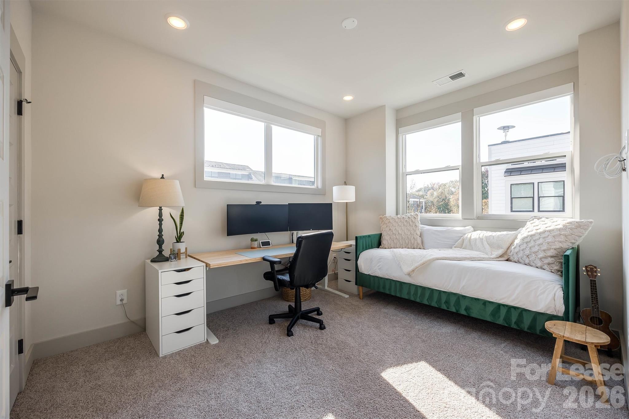 2319 Wesley Village Road Charlotte, NC 28208 - Photo 25 of 44 a bedroom with furniture and a window