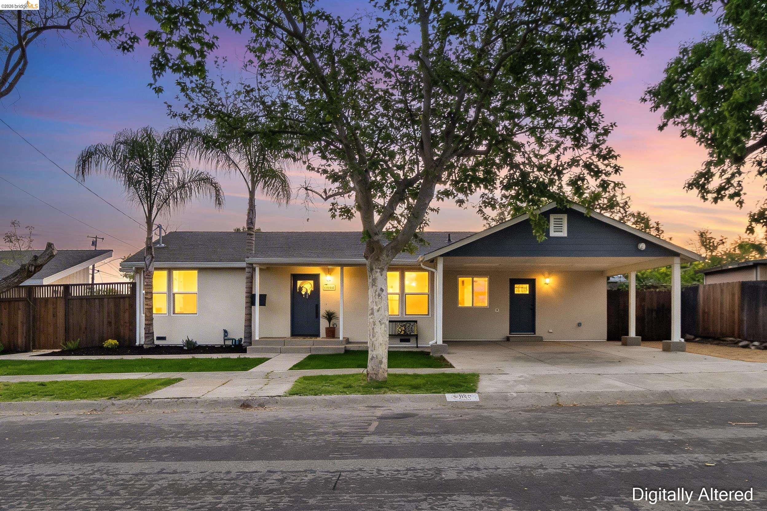 3015 Stevenson Street Pittsburg, CA 94565 - Photo 1 of 1 a front view of a house with a yard and potted plants