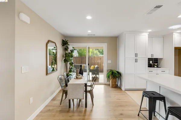 a dining room with furniture and window