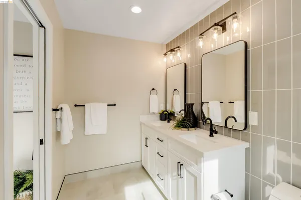 a bathroom with a toilet sink and shower