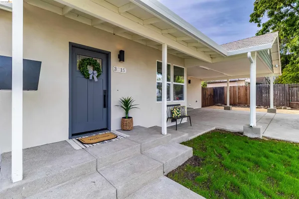 a view of an house with backyard porch and sitting area
