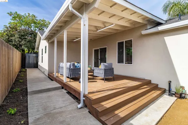 a view of a balcony with chair and front door