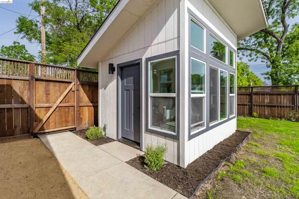 an aerial view of residential house with outdoor space and street view