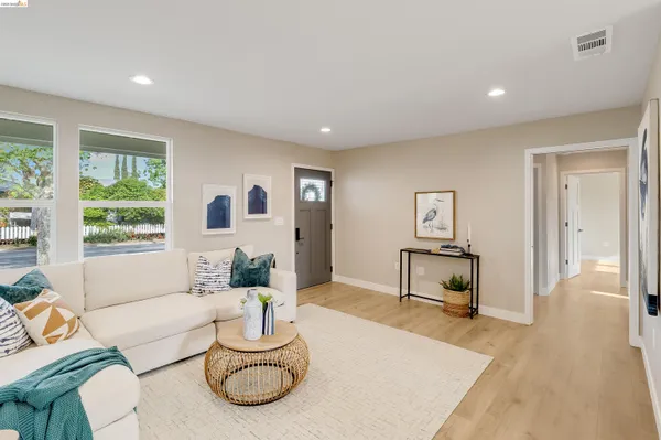 a living room with furniture and a table
