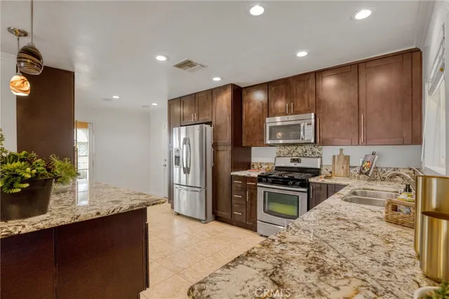 a living room with furniture and a lamp