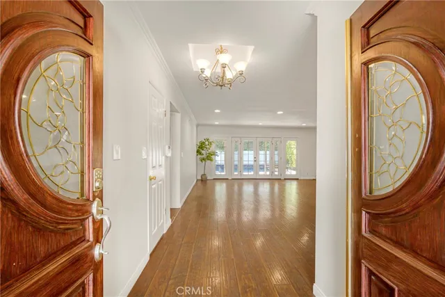 a kitchen with refrigerator and cabinets