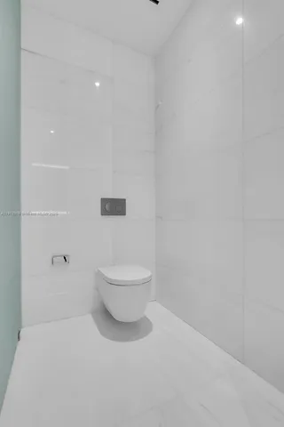 a bathroom with a shower and a sink