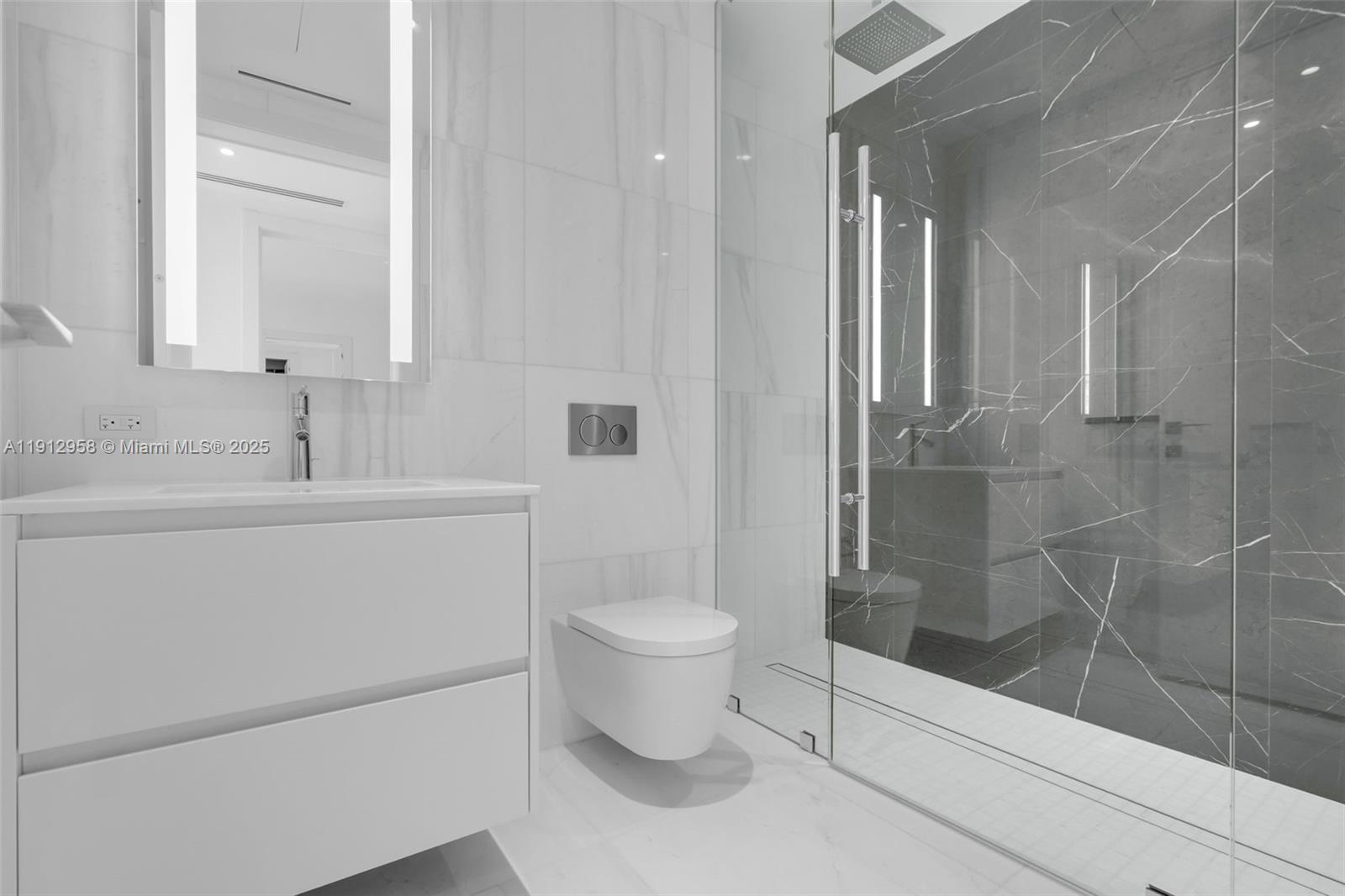 300 Biscayne Blvd Way, Unit 3009 Miami, FL 33131 - Photo 21 of 52 a bathroom with a sink toilet and shower