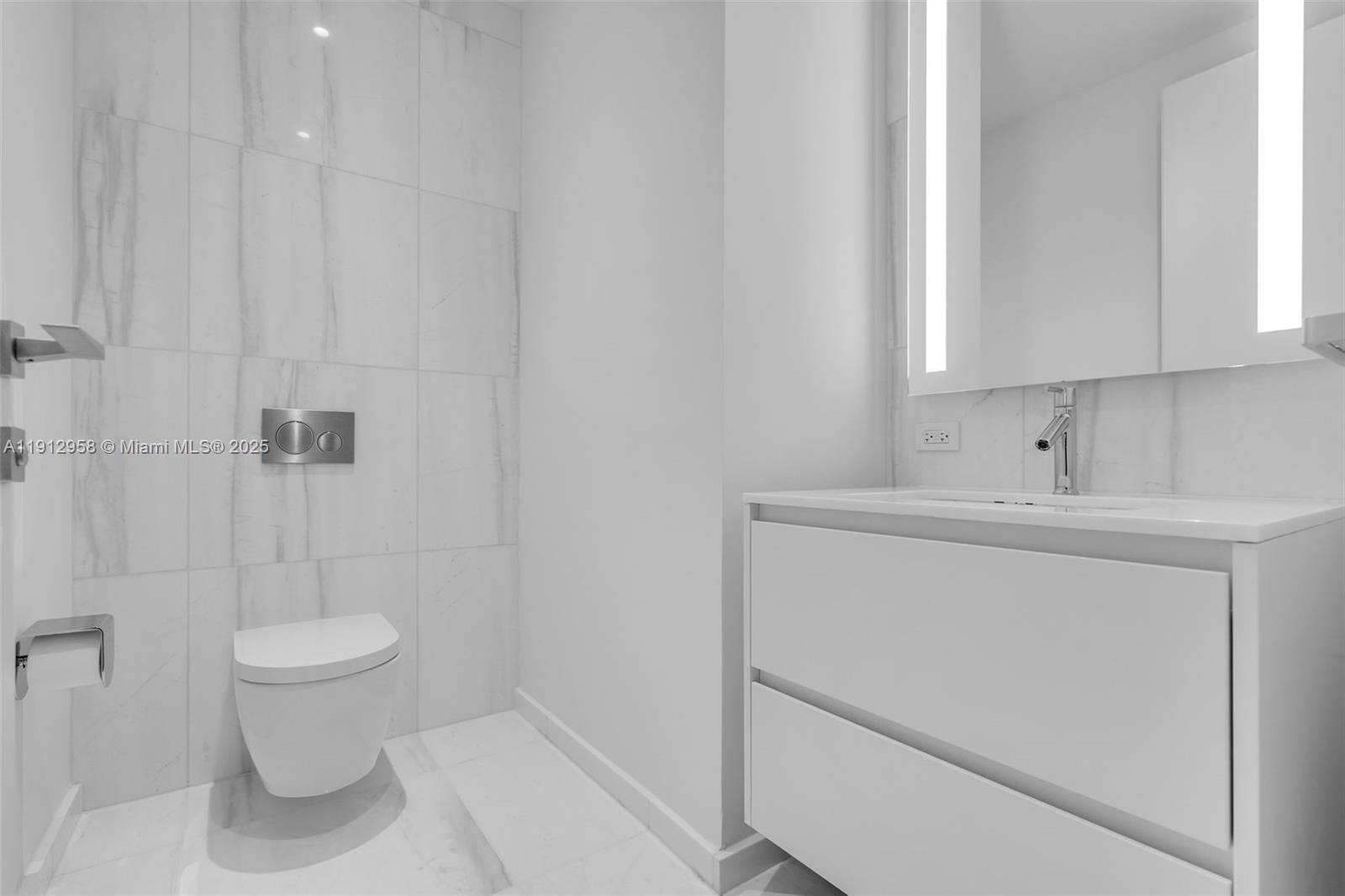 300 Biscayne Blvd Way, Unit 3009 Miami, FL 33131 - Photo 22 of 52 a bathroom with a sink a toilet and a shower