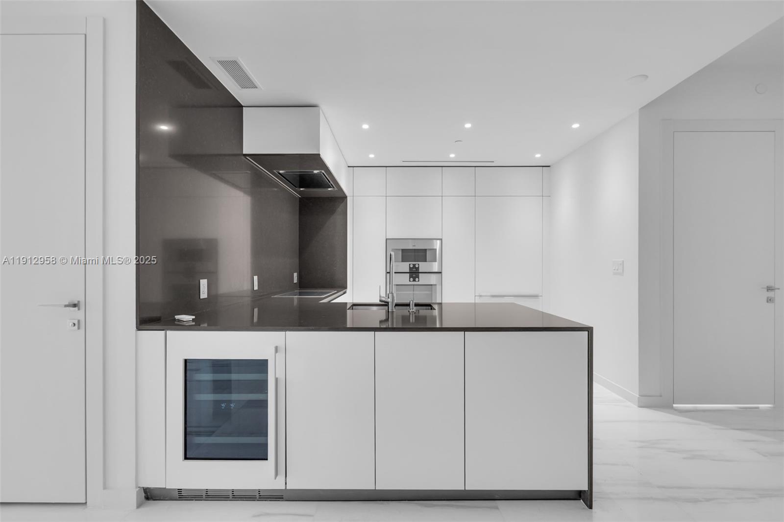 300 Biscayne Blvd Way, Unit 3009 Miami, FL 33131 - Photo 6 of 52 a bathroom with a sink a mirror and a shower