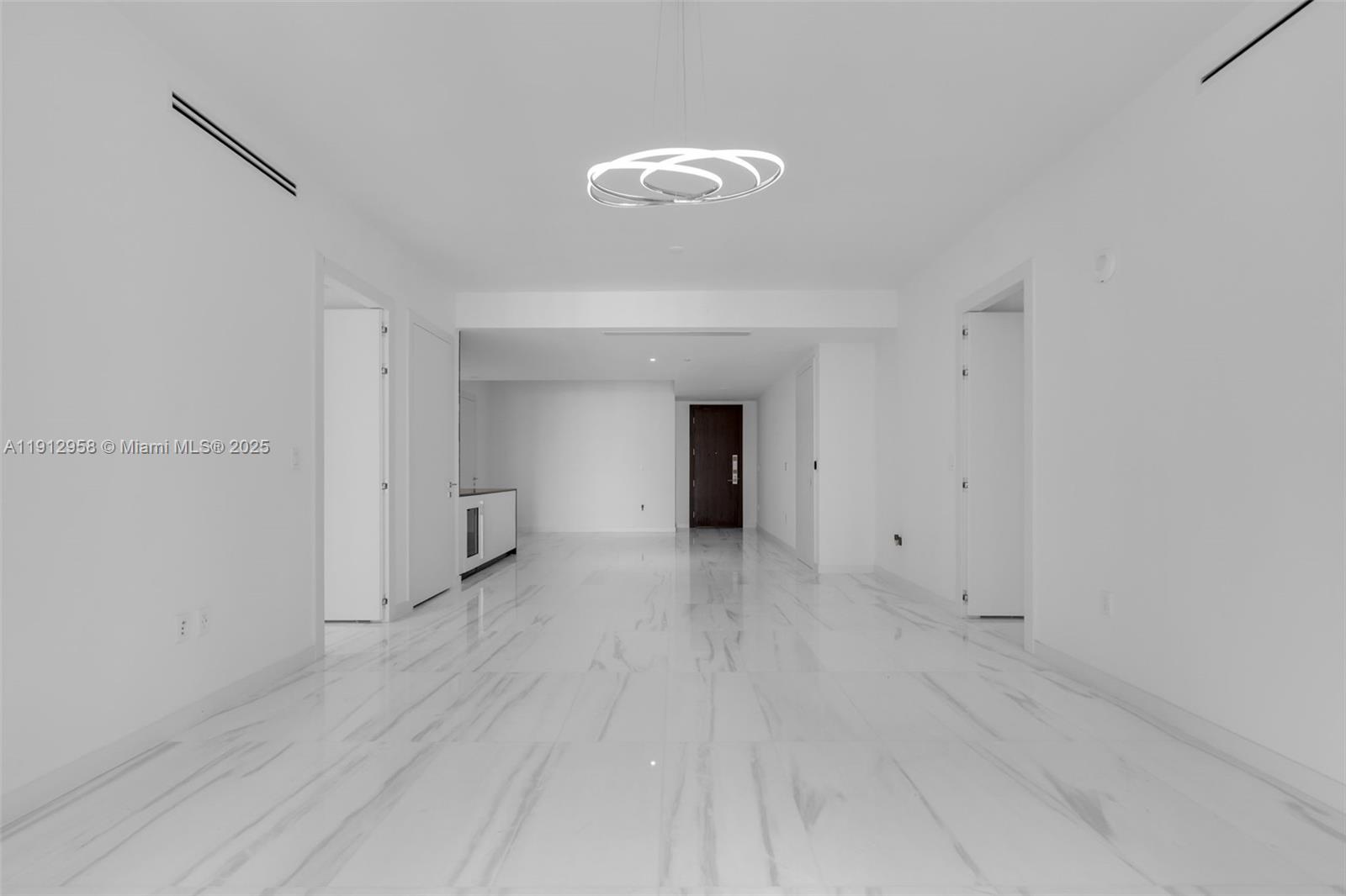 300 Biscayne Blvd Way, Unit 3009 Miami, FL 33131 - Photo 10 of 52 a view of an empty room with wooden floor and a window