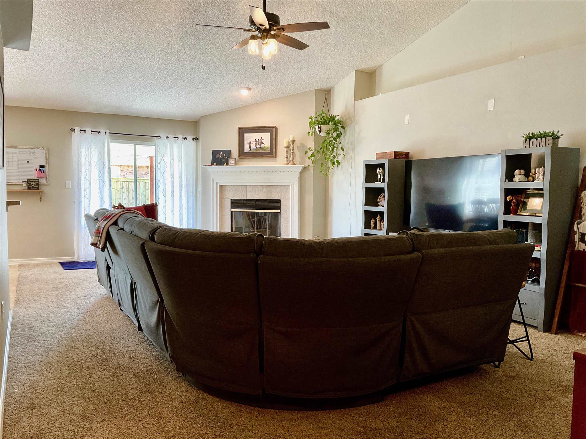 596 Batten Boulevard Pensacola, FL 32507 - Photo 11 of 48 a living room with furniture and a flat screen tv