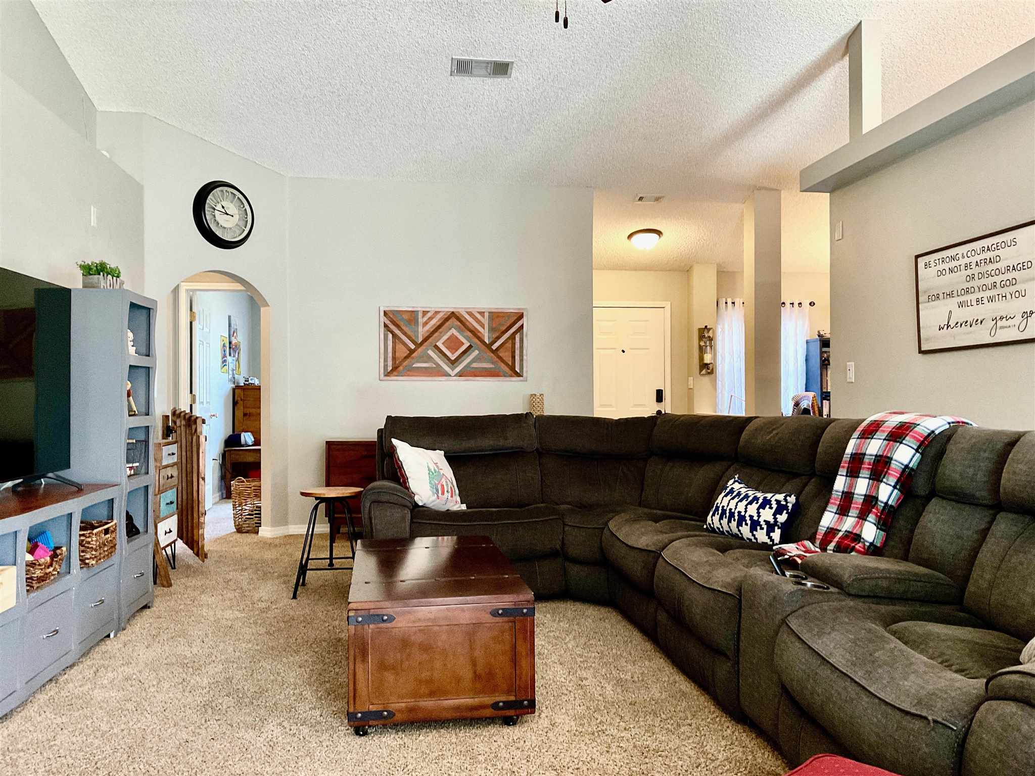 596 Batten Boulevard Pensacola, FL 32507 - Photo 12 of 48 a living room with furniture and a flat screen tv