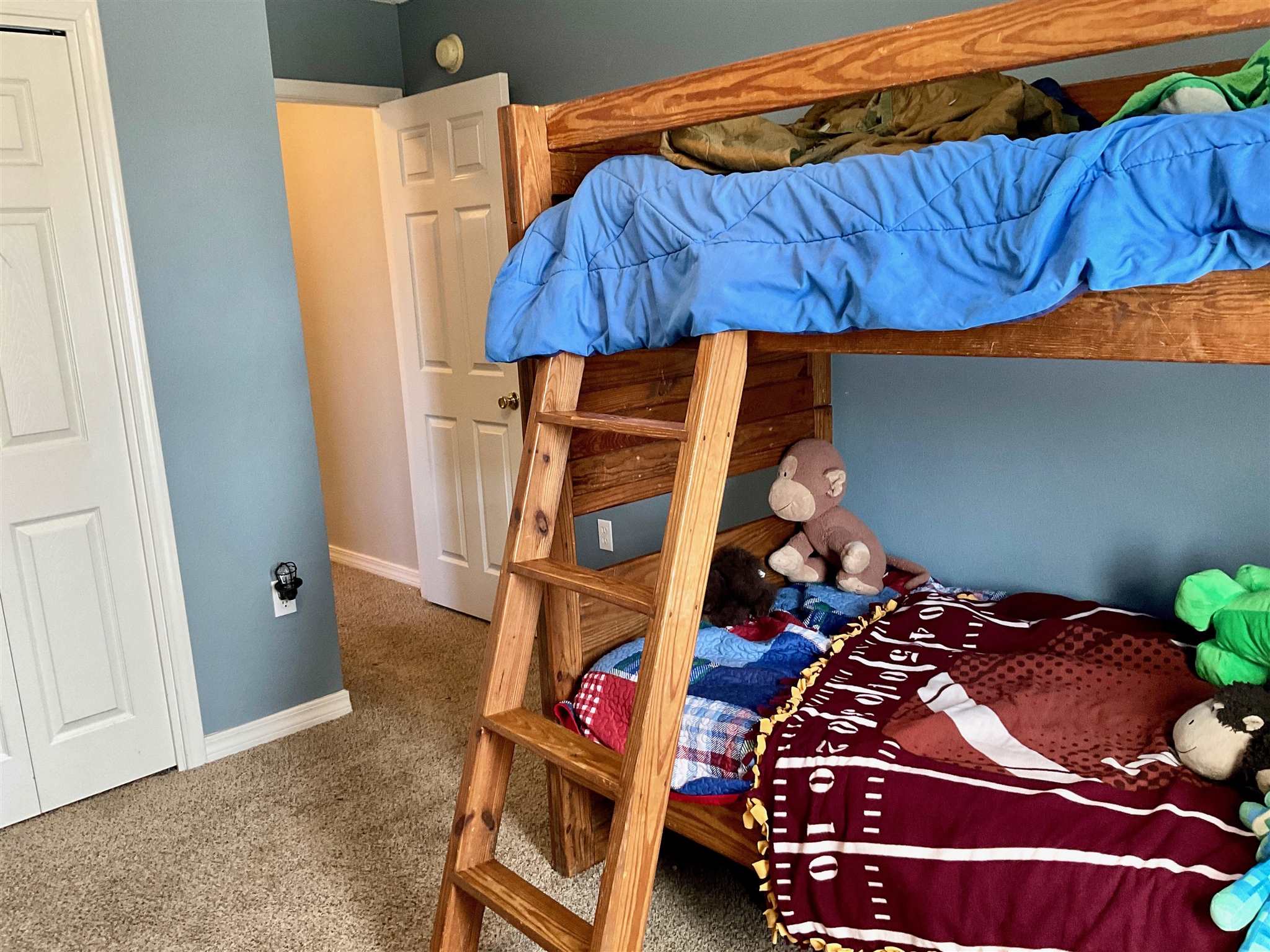 596 Batten Boulevard Pensacola, FL 32507 - Photo 37 of 48 a bedroom with a bed and a closet