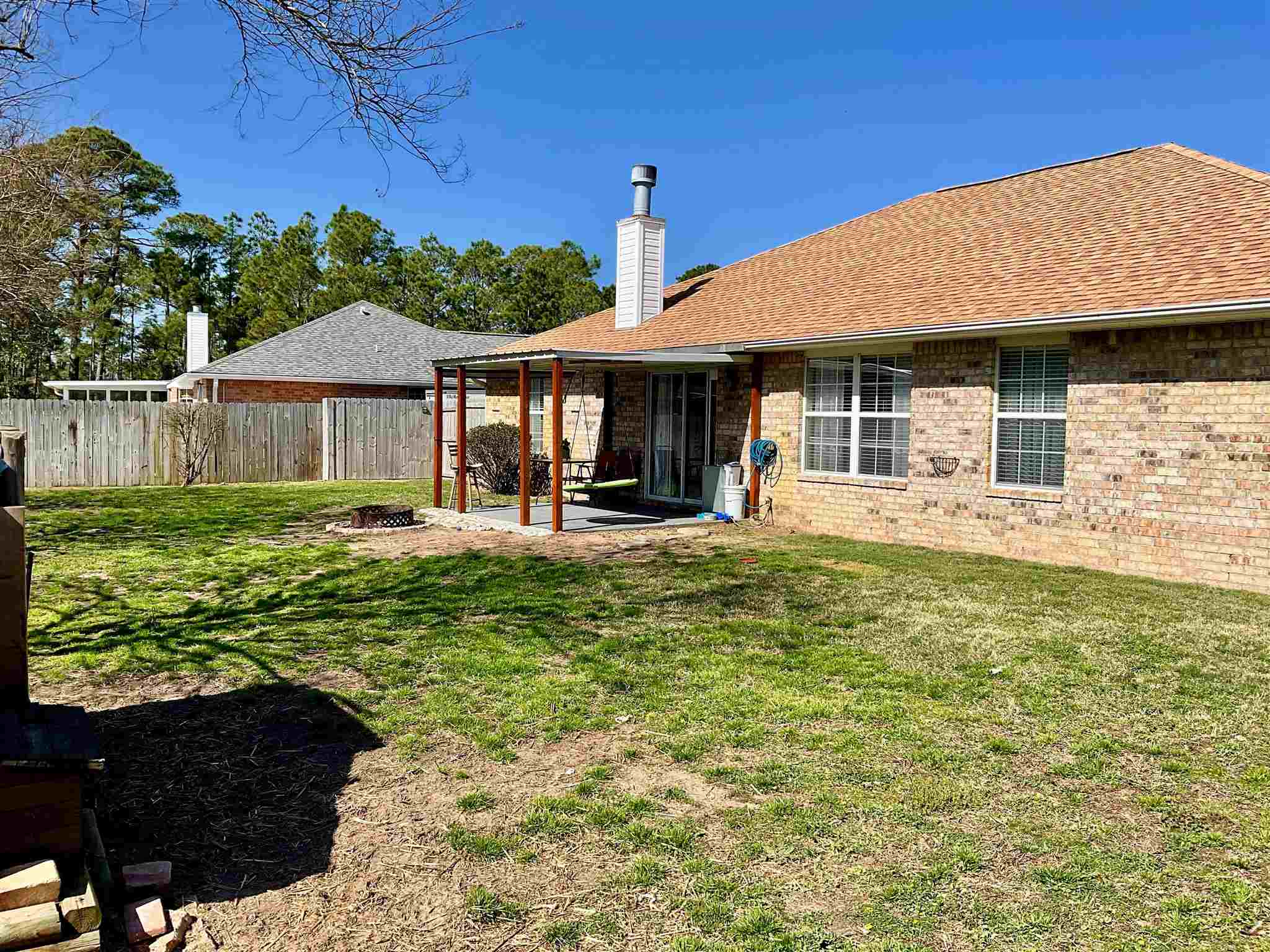 596 Batten Boulevard Pensacola, FL 32507 - Photo 42 of 48 a front view of a house with a yard