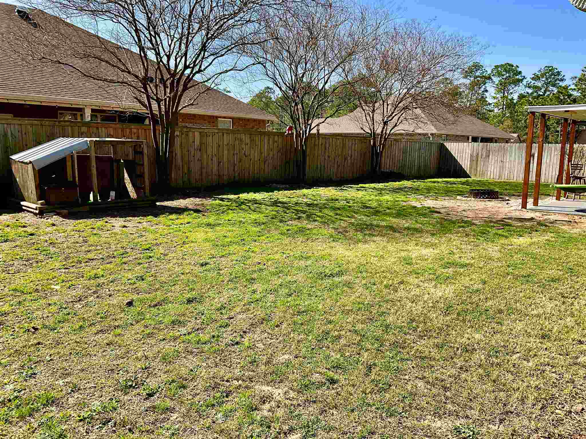 596 Batten Boulevard Pensacola, FL 32507 - Photo 45 of 48 a front view of house with yard and trees