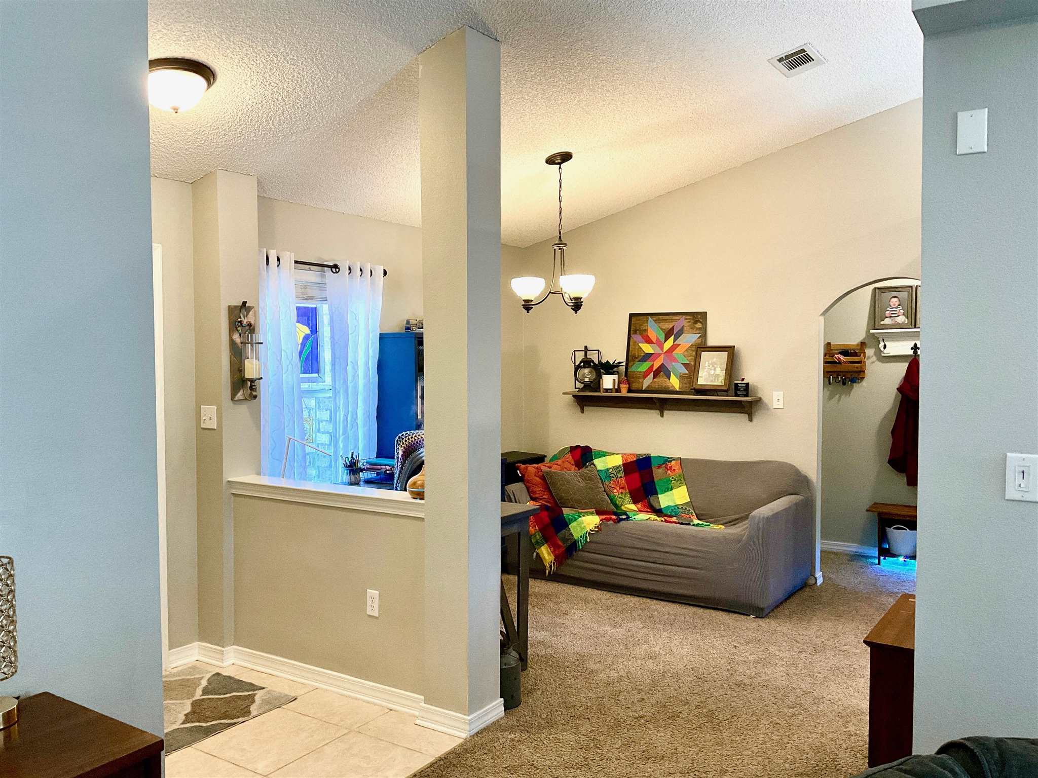 596 Batten Boulevard Pensacola, FL 32507 - Photo 7 of 48 a living room with furniture and a flat screen tv