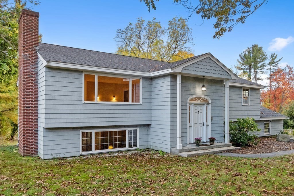 22 Sunset Rock Road Andover, MA 01810 - Photo 1 of 38 a front view of a house with a garden