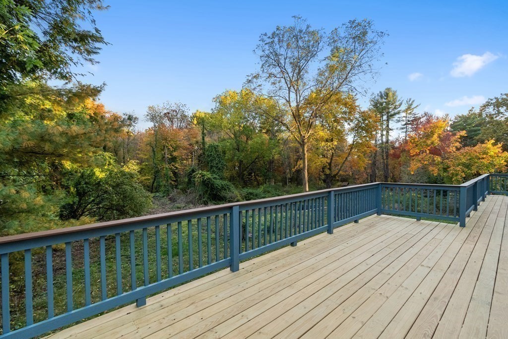 22 Sunset Rock Road Andover, MA 01810 - Photo 12 of 38 a view of balcony with wooden floor and fence
