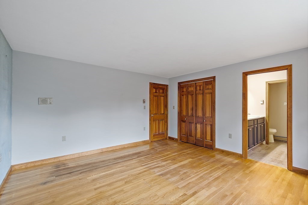22 Sunset Rock Road Andover, MA 01810 - Photo 14 of 38 a view of empty room with wooden floor and fan