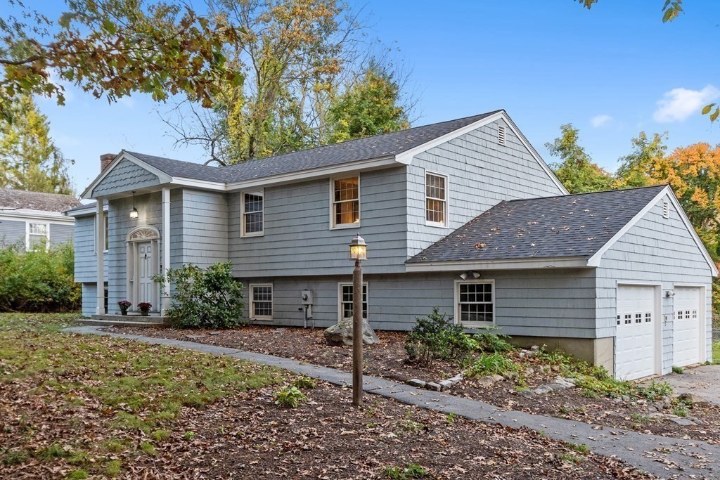 22 Sunset Rock Road Andover, MA 01810 - Photo 2 of 38 a front view of a house with garden