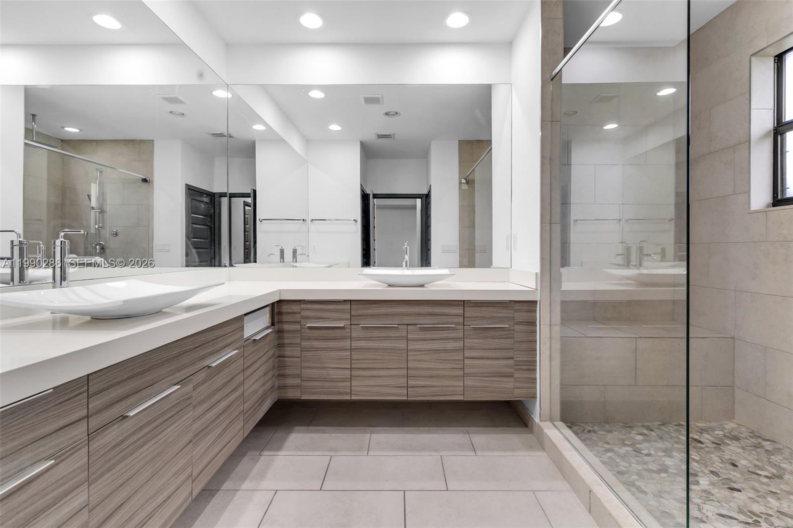 16058 Southwest 136 Way Miami, FL 33196 - Photo 13 of 21 a bathroom with a sink a vanity and a mirror