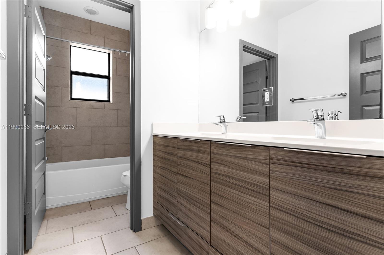 16058 Southwest 136 Way Miami, FL 33196 - Photo 16 of 21 a bathroom with a bathtub and a sink
