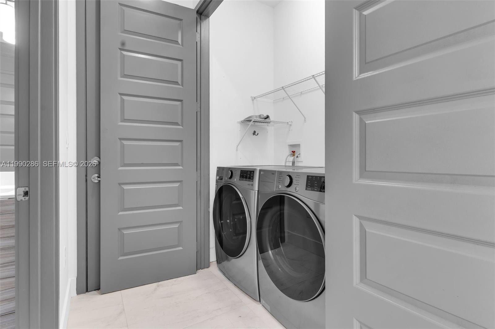 16058 Southwest 136 Way Miami, FL 33196 - Photo 18 of 21 a utility room with dryer and washer