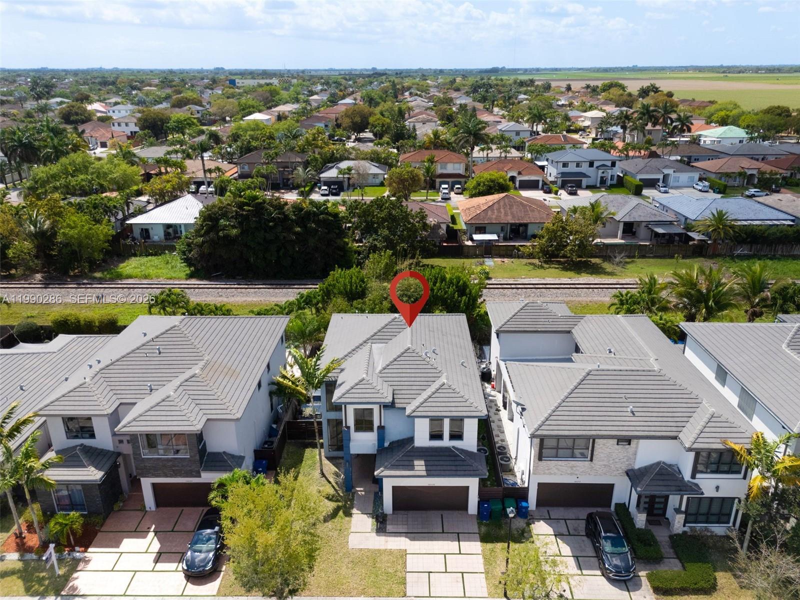 16058 Southwest 136 Way Miami, FL 33196 - Photo 21 of 21 an aerial view of multiple house