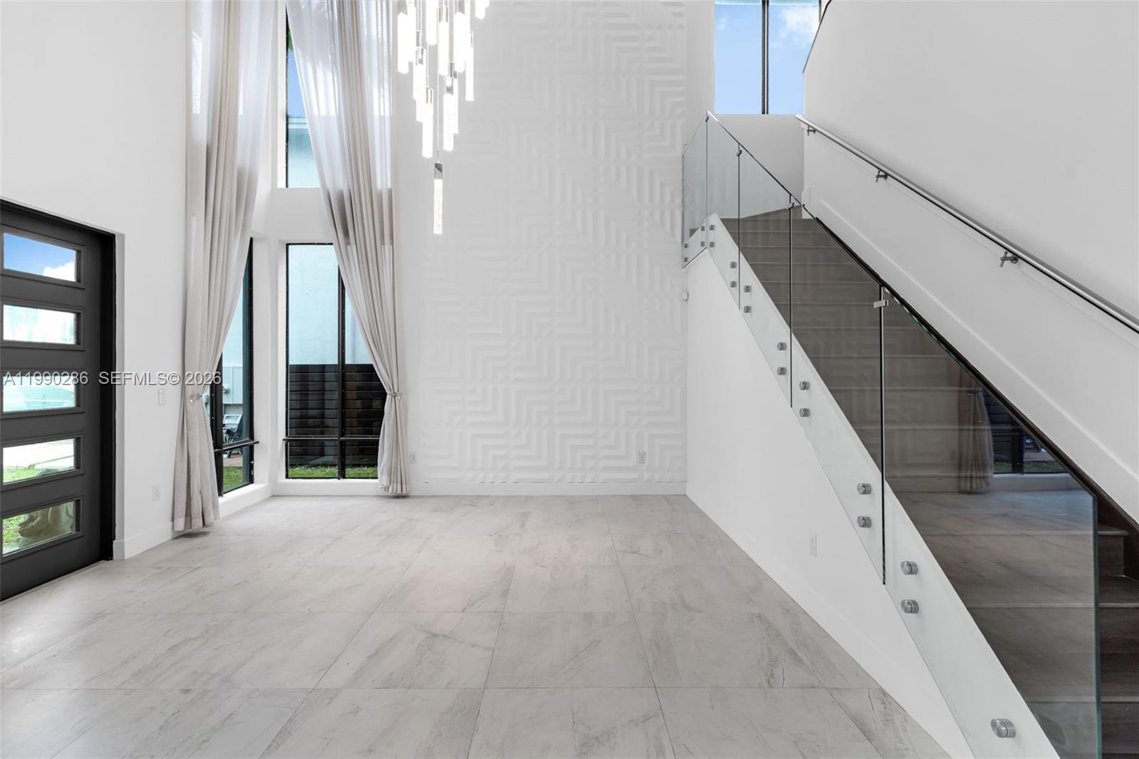 16058 Southwest 136 Way Miami, FL 33196 - Photo 3 of 21 a view of a hallway with staircase