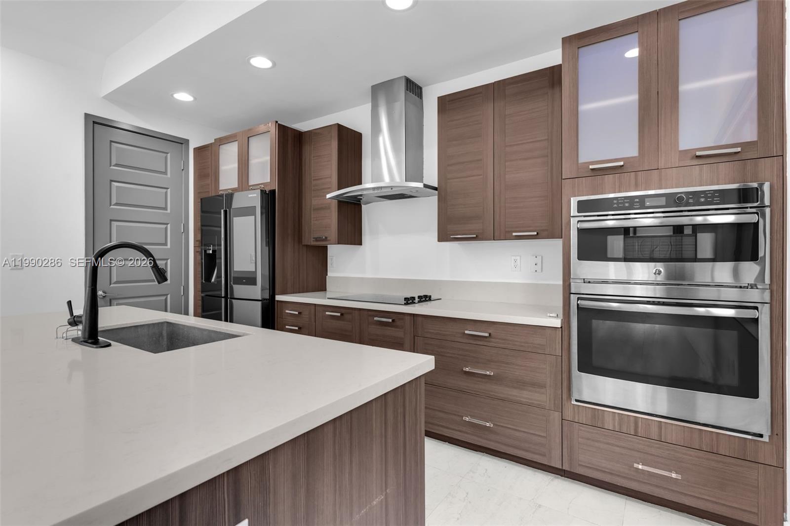 16058 Southwest 136 Way Miami, FL 33196 - Photo 7 of 21 a kitchen with stainless steel appliances a sink stove and refrigerator