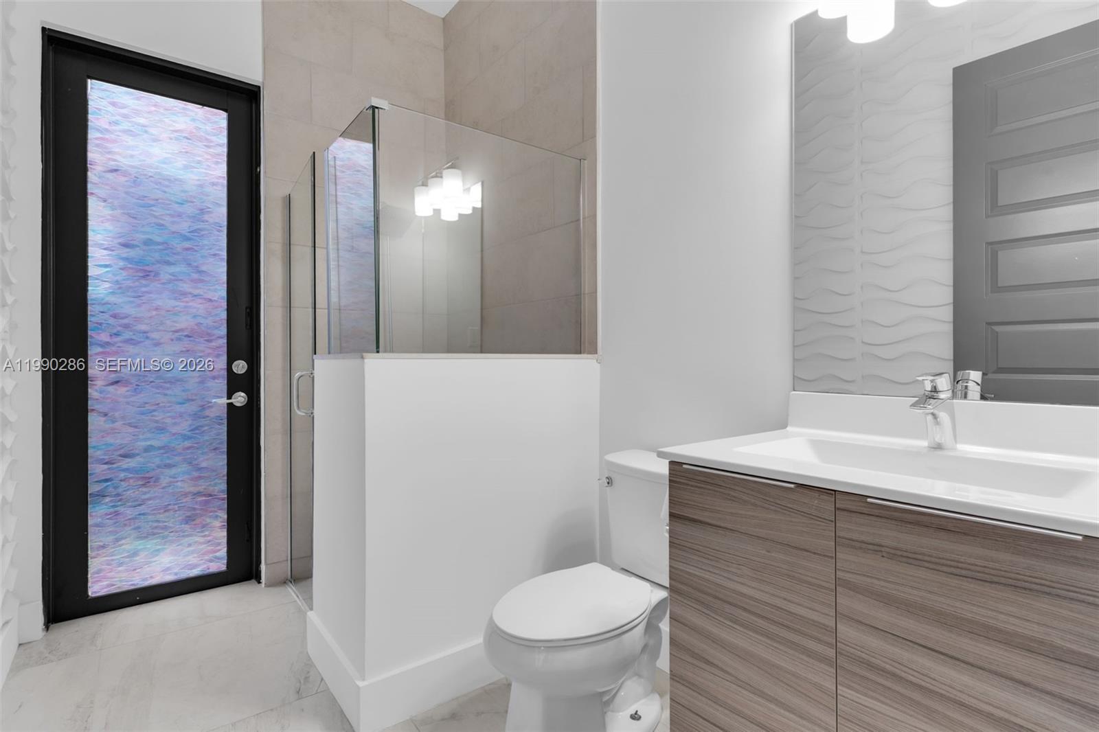 16058 Southwest 136 Way Miami, FL 33196 - Photo 9 of 21 a bathroom with a sink and a toilet