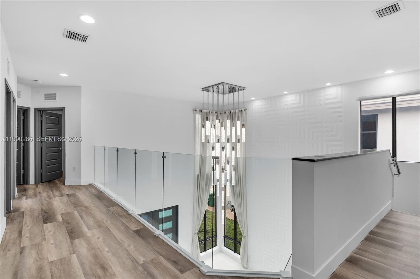 16058 Southwest 136 Way Miami, FL 33196 - Photo 10 of 21 a view of entryway with wooden floor